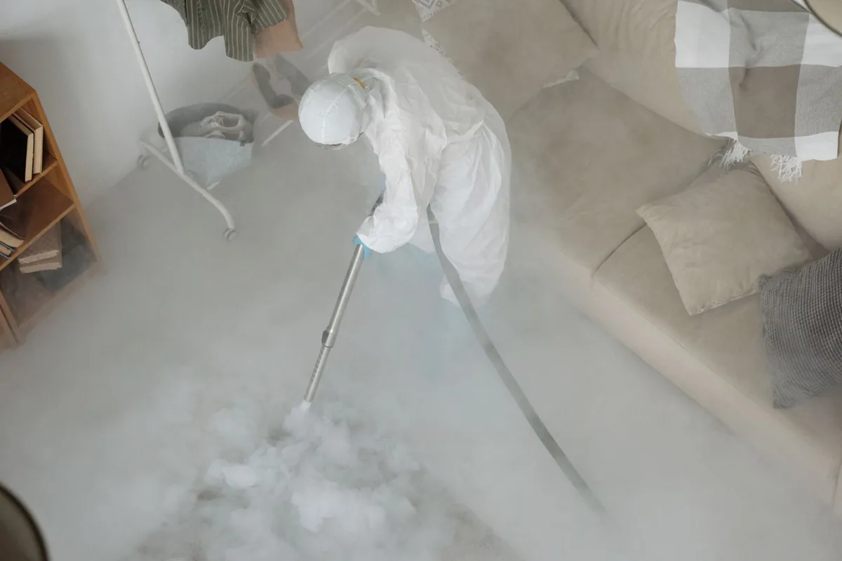 Biohazard cleanup technician in protective equipment, Dresden, OH